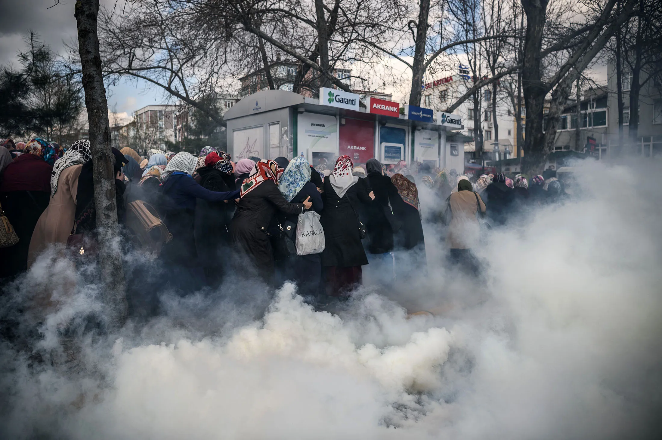 Turkish anti-riot police use tear gas to disperse supporters in front of the headquarters of the Turkish daily newspaper.
