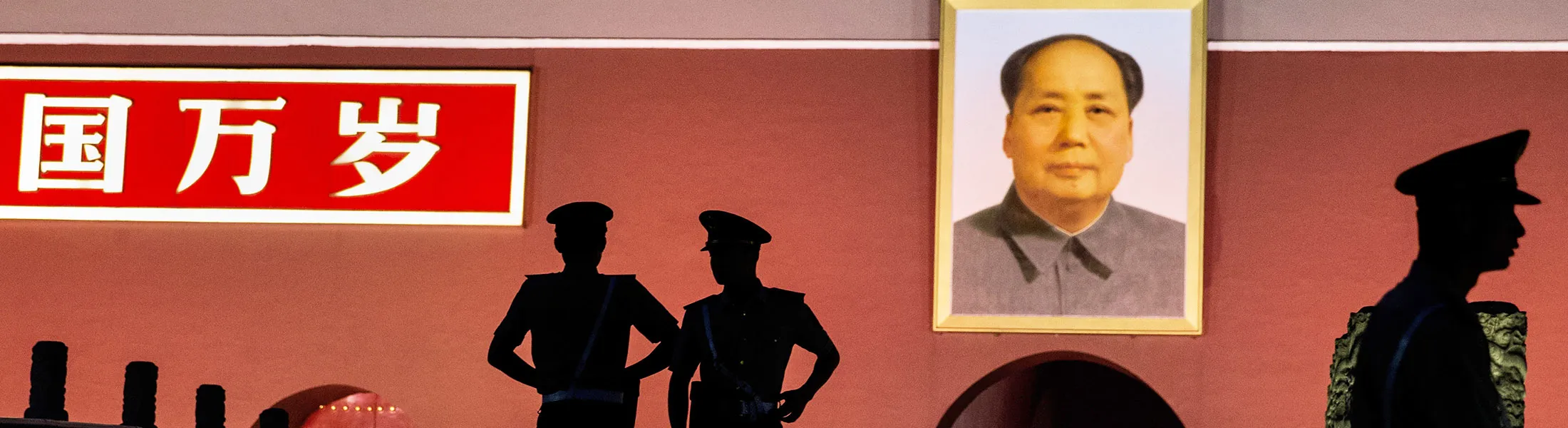 BEIJING, CHINA - JUNE 03:  Chinese Paramilitary police officers stand guard below a portrait of the late leader Mao Zedong in front of the Forbidden City at Tiananmen Square on June 4, 2014 in Beijing, China. Twenty-five years ago on June 4, 1989 Chinese troops cracked down on pro-democracy protesters and in the clashes that followed scores were killed and injured.  (Photo by Kevin Frayer/Getty Images)
