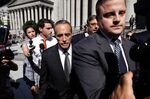 Christopher Collins, center, exits federal court in New York on Aug. 8, 2018.
