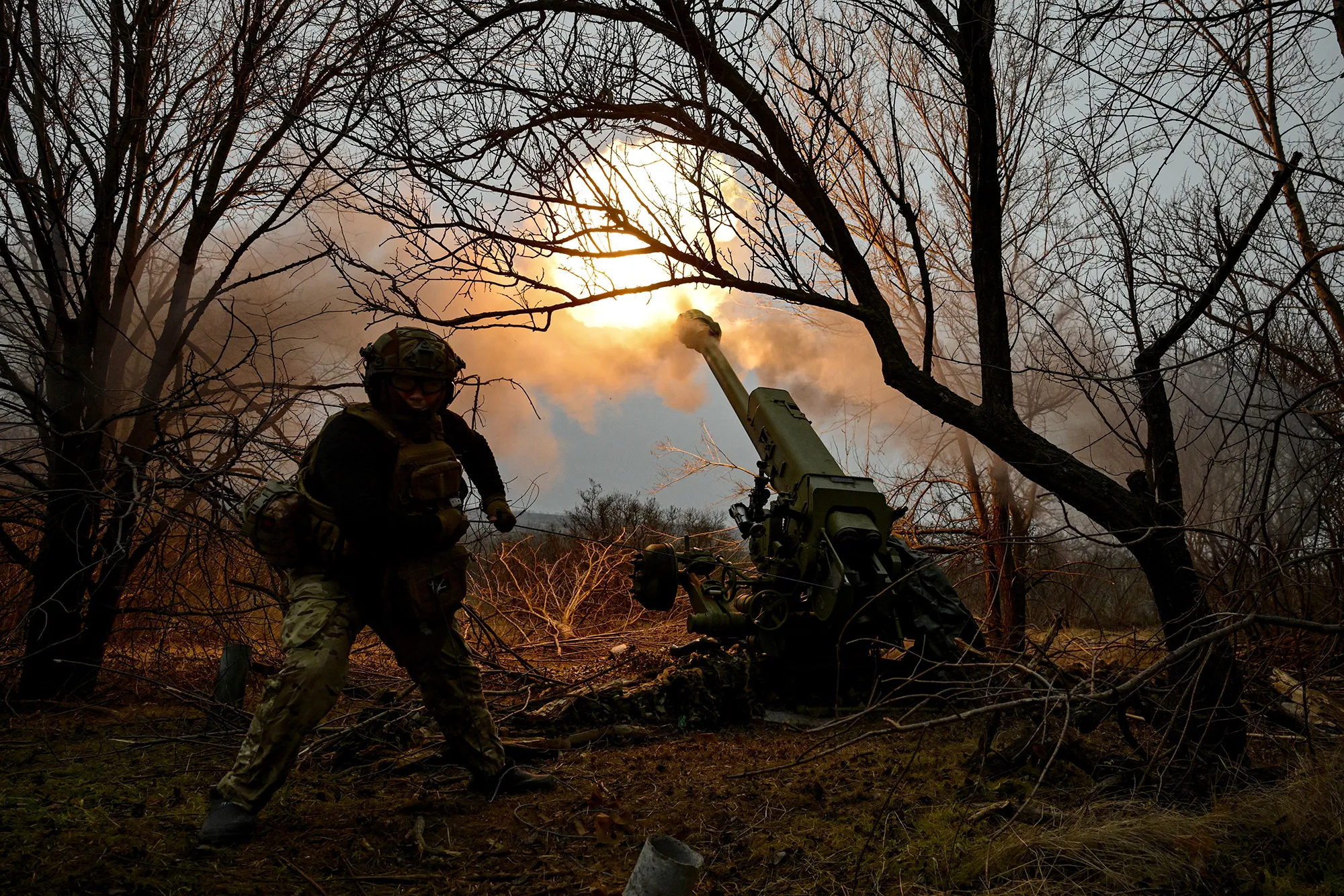 Soldiers of an artillery crew&nbsp;fire a&nbsp;howitzer at the positions of Russian troops in the Zaporizhzhia region, Ukraine, on Jan. 11.