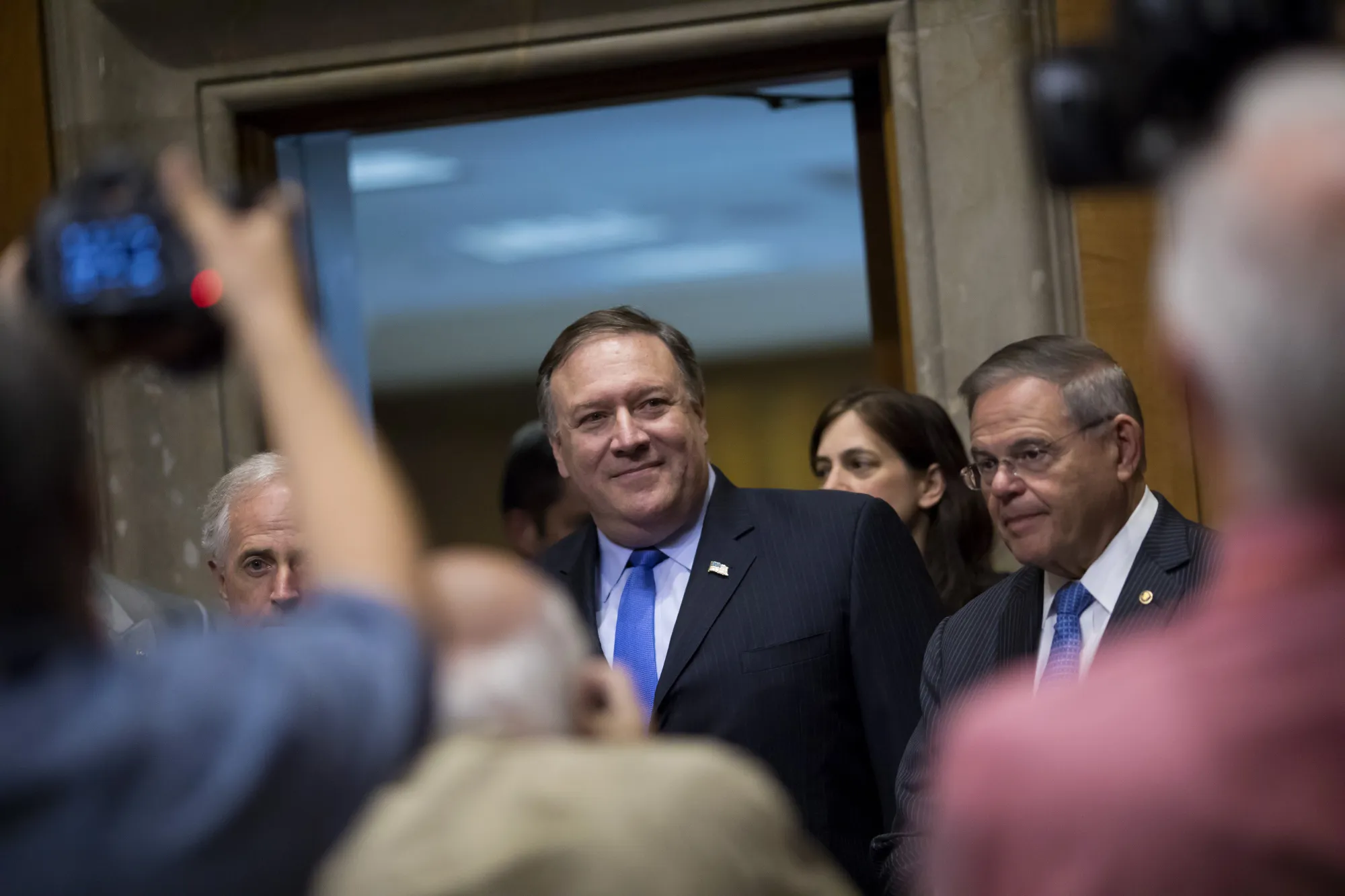 Mike Pompeo, center,&nbsp;arrives to a Senate Foreign Relations Committee hearing in Washington, D.C.,&nbsp;on&nbsp;July 25, 2018
