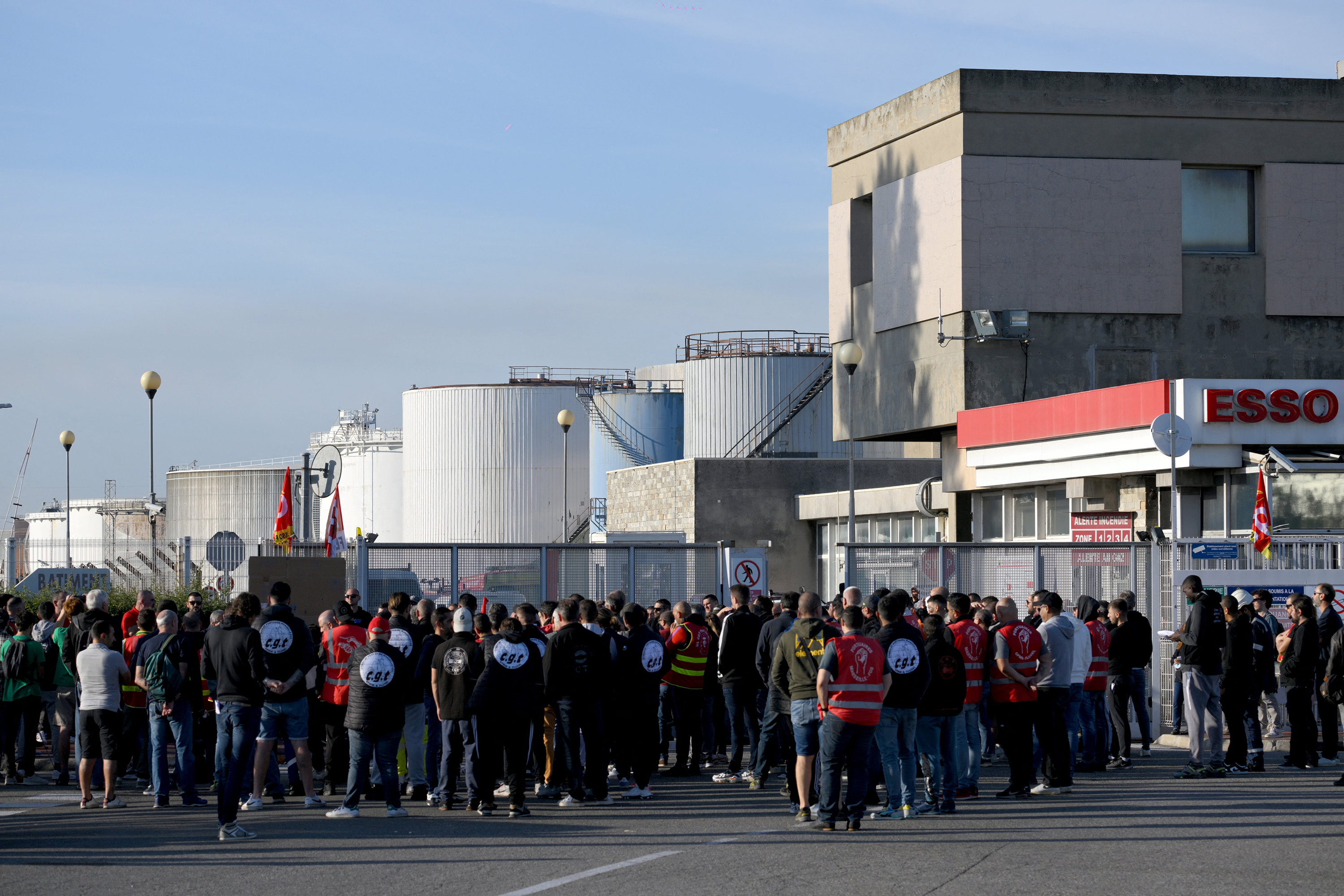 Striking workers outside Esso’s oil refinery in Fos-sur-Mer, France, on Oct. 11.