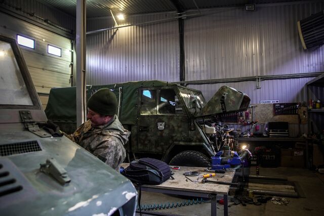 A 90 minute drive from Kyiv, a team of about 12 self-taught mechanics work on three vehicles at a time, refurbishing off-road troop transporters discarded by the Italian military.