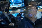 Traders work on the floor of the New York Stock Exchange.