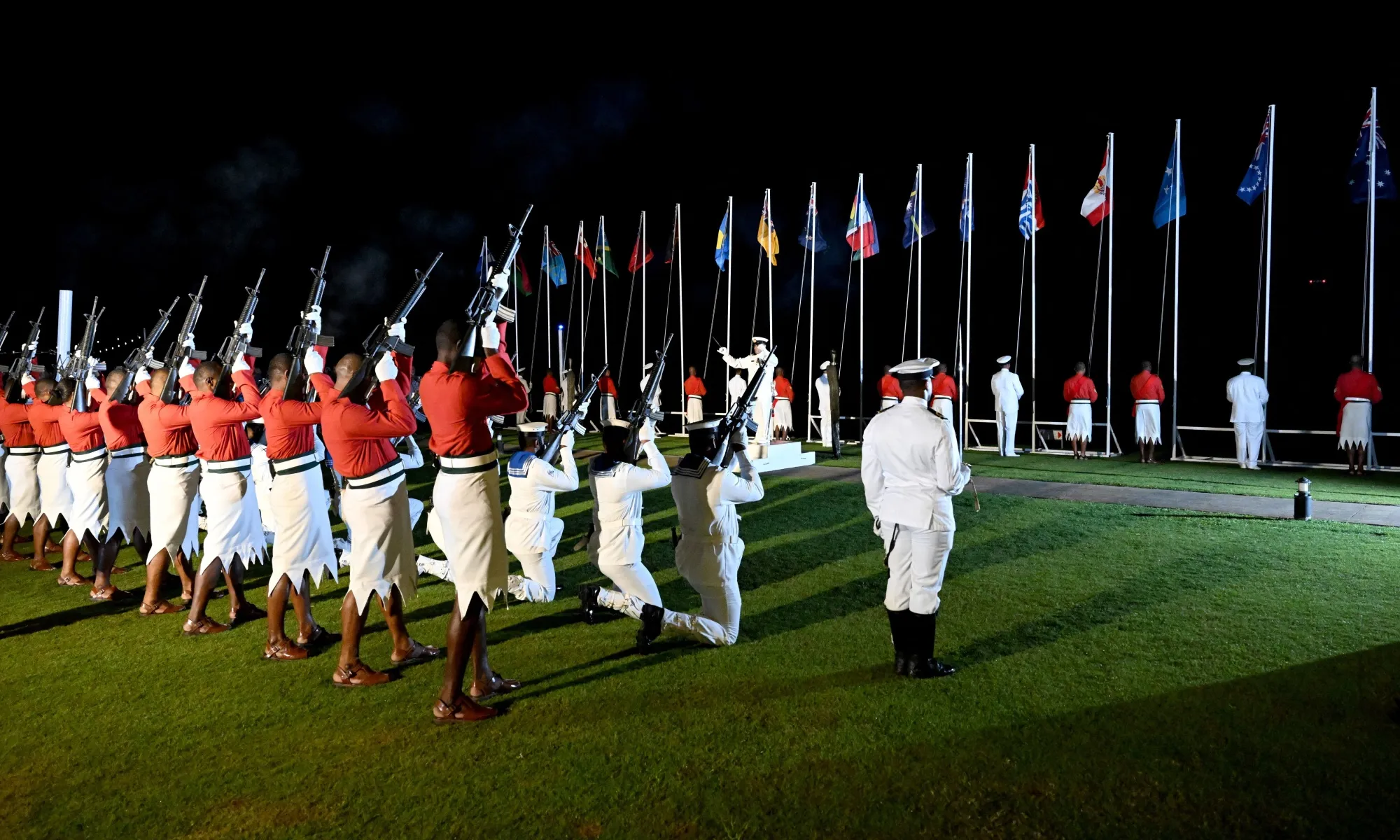 An honour guard fires a gun salute during the Beating of the Retreat ceremony at the end of the Pacific Islands Forum.