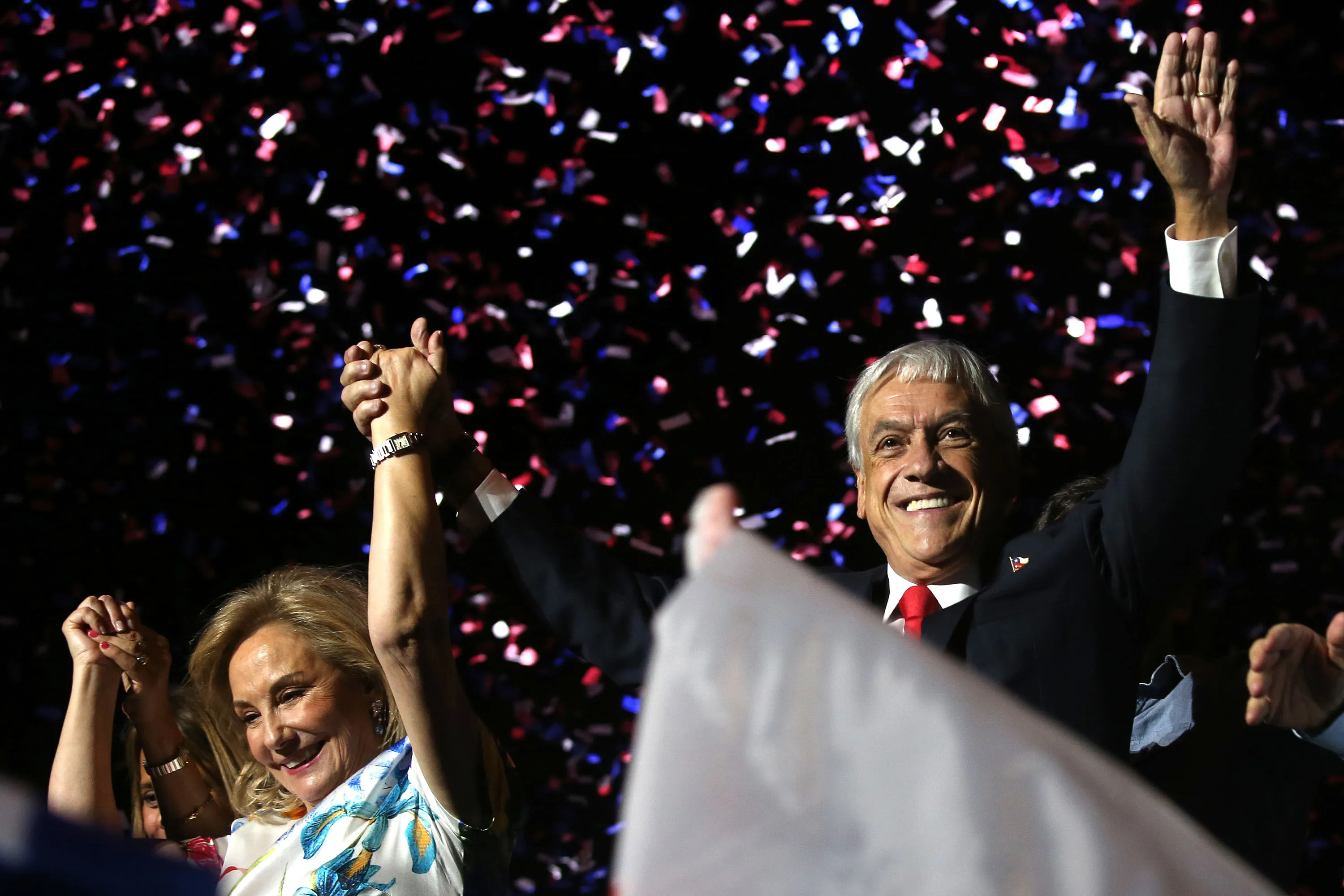 Sebastian Pinera celebrate his victory with family and supporters in Santiago on Dec. 17.