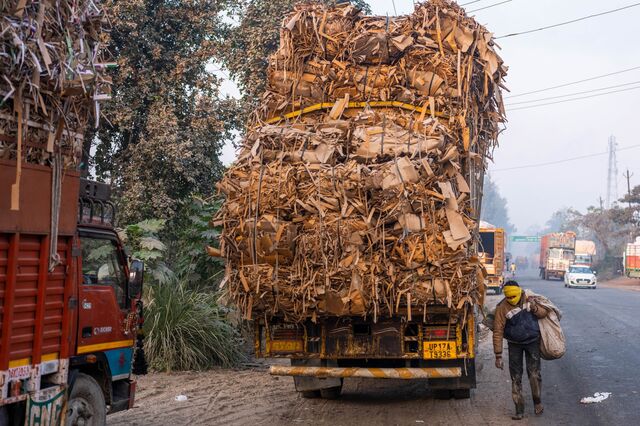 Raw material trucks are parked outside paper mills, in Muzaffarnagar District, Uttar Pradesh, India, on Friday, Nov. 18, 2022. Photographer: Prashanth Vishwanathan/Bloomberg
