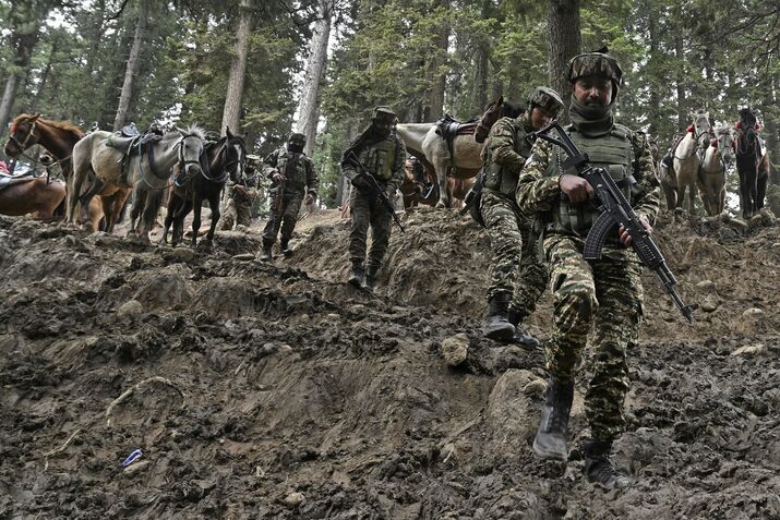 Indian soldiers search an area following the attack, near Pahalgam, Jammu and Kashmir, on April 23.