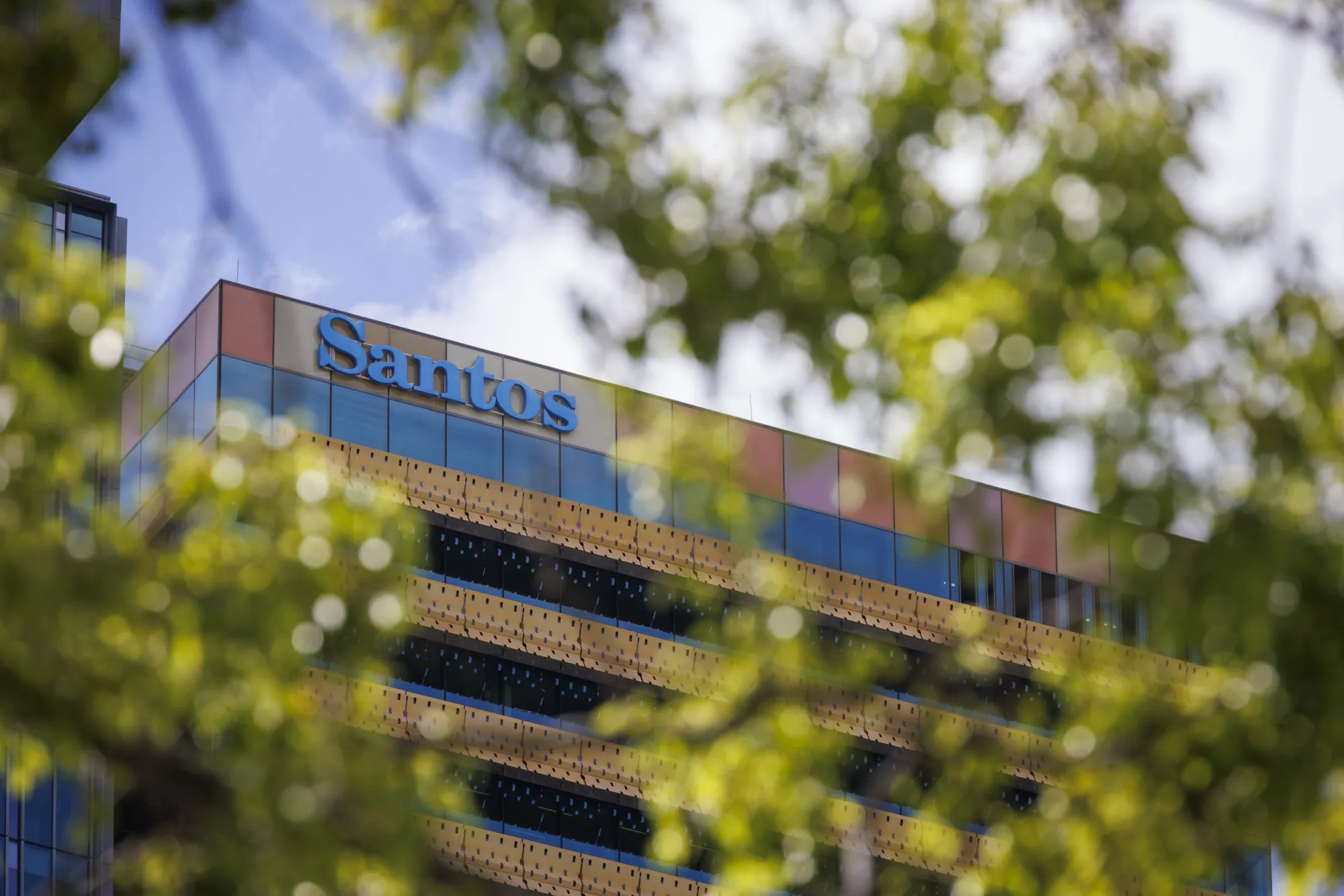 The Santos Ltd. Logo atop Santos Place building, which houses the company's office, in Brisbane, Australia, on Monday, Dec. 11, 2023.