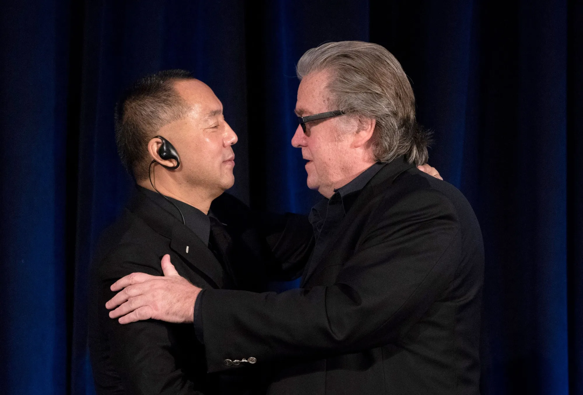 Steve Bannon greets Wengui Guo in 2018.