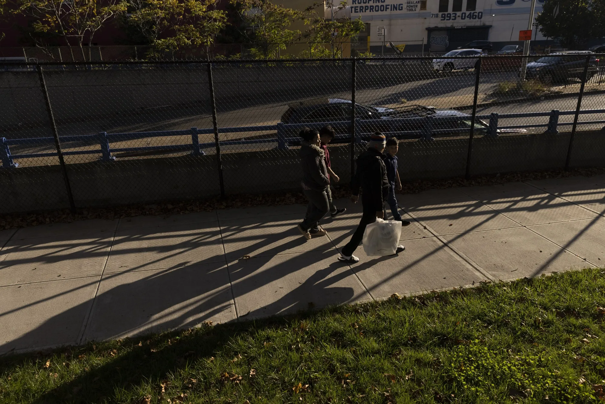 A migrant family walks to their temporary shelter in the Bronx.
