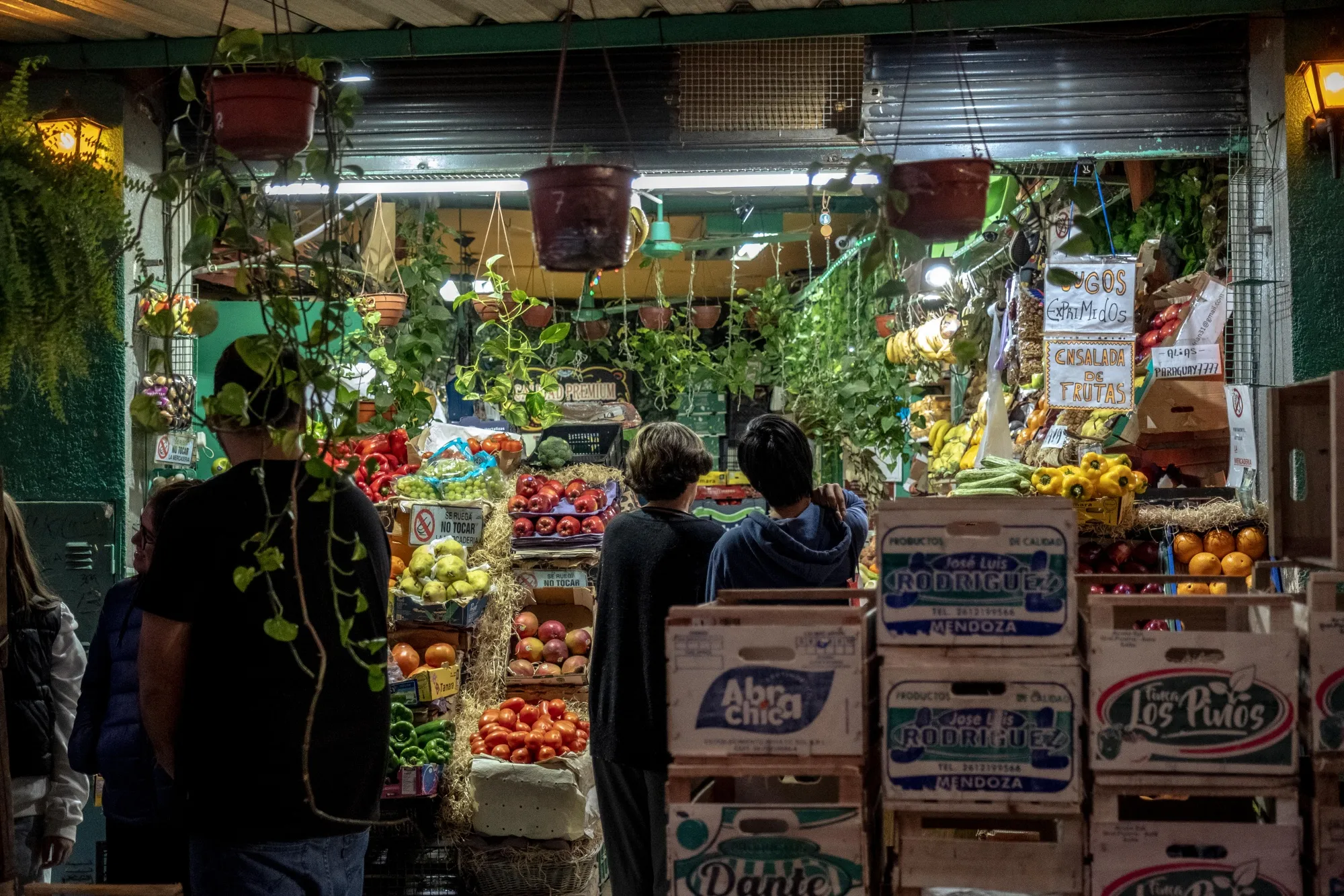 Shoppers browse produce at a grocery store in Buenos Aires.