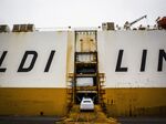 Audi vehicles are loaded for export at the port of Barcelona.