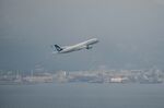 A passenger aircraft operated by Cathay Pacific Airways Ltd. takes off from the Hong Kong International Airport.