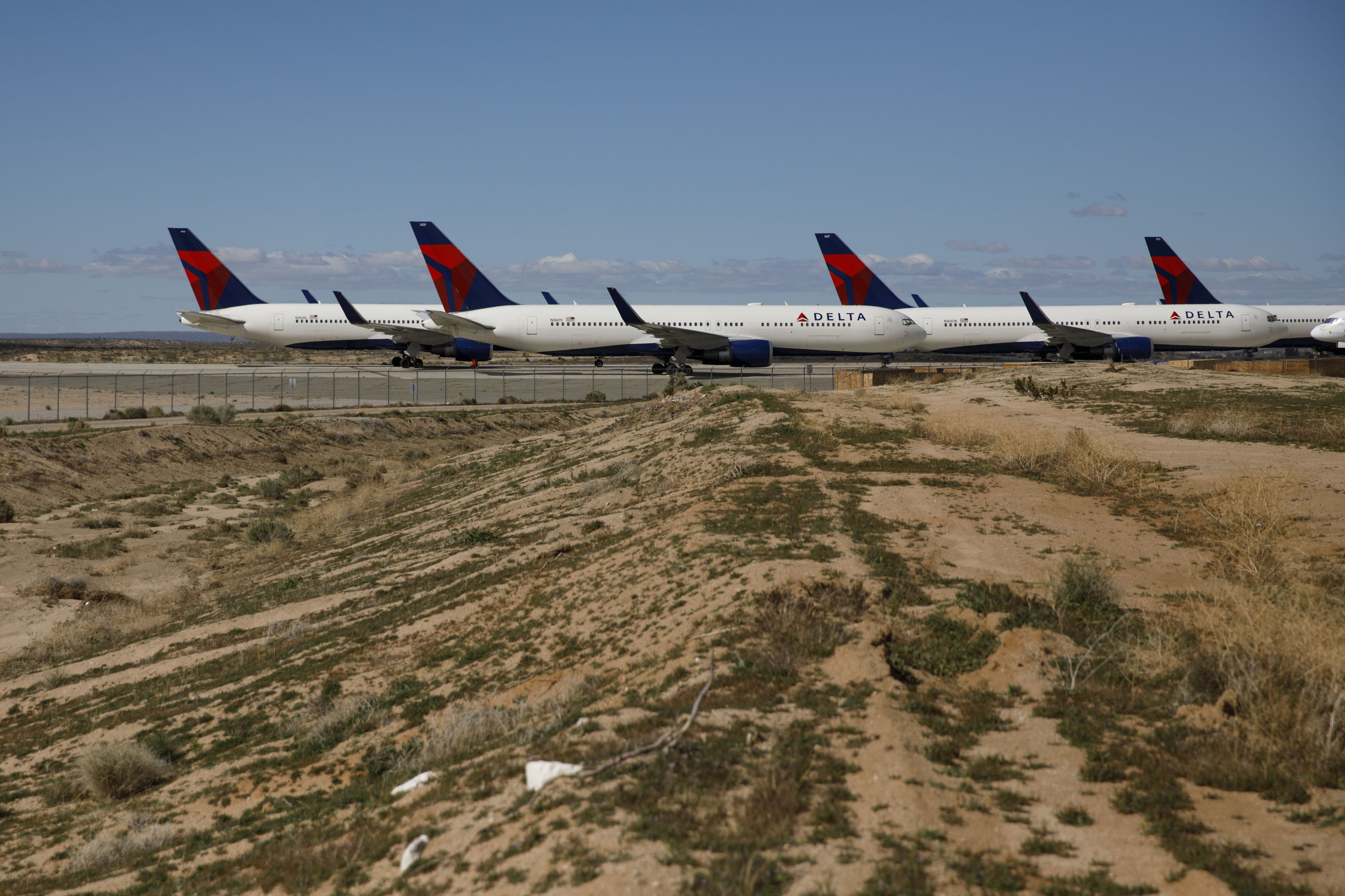 Delta Air Lines aircraft sit parked at a field in Victorville, California on March 23.