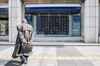 A man looks at an electronic stock board outside a securities firm in Tokyo, Japan, on Tuesday, Dec. 25, 2018.