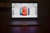 The Apple iPhone 12 is unveiled during a virtual product launch seen on a laptop.