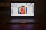 The Apple iPhone 12 is unveiled during a virtual product launch seen on a laptop.