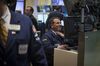 A trader works on the floor the New York Stock Exchange (NYSE) in New York, U.S., on Wednesday, April 17, 2013. U.S. stocks sank, erasing yesterday's rally, amid losses in industrial metals and disappointing results from Bank of America Corp. The euro slid as German central bank chief Jens Weidmann reportedly said European policy makers may cut rates if needed.