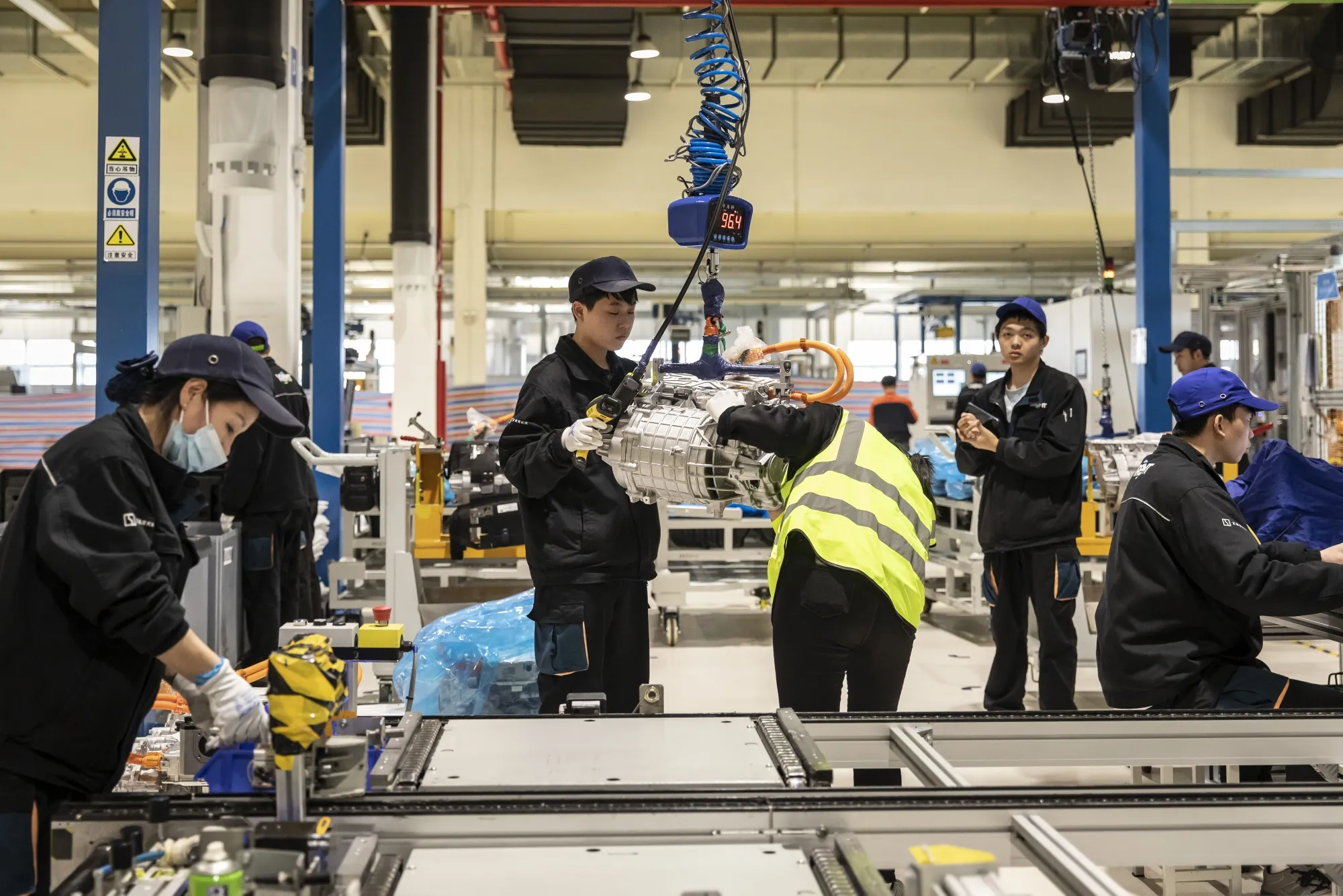 Workers on the production line at Zhejiang Geely Holding Group Co.'s Viridi E-Energy Mobility Technology Co. factory in Ningbo.