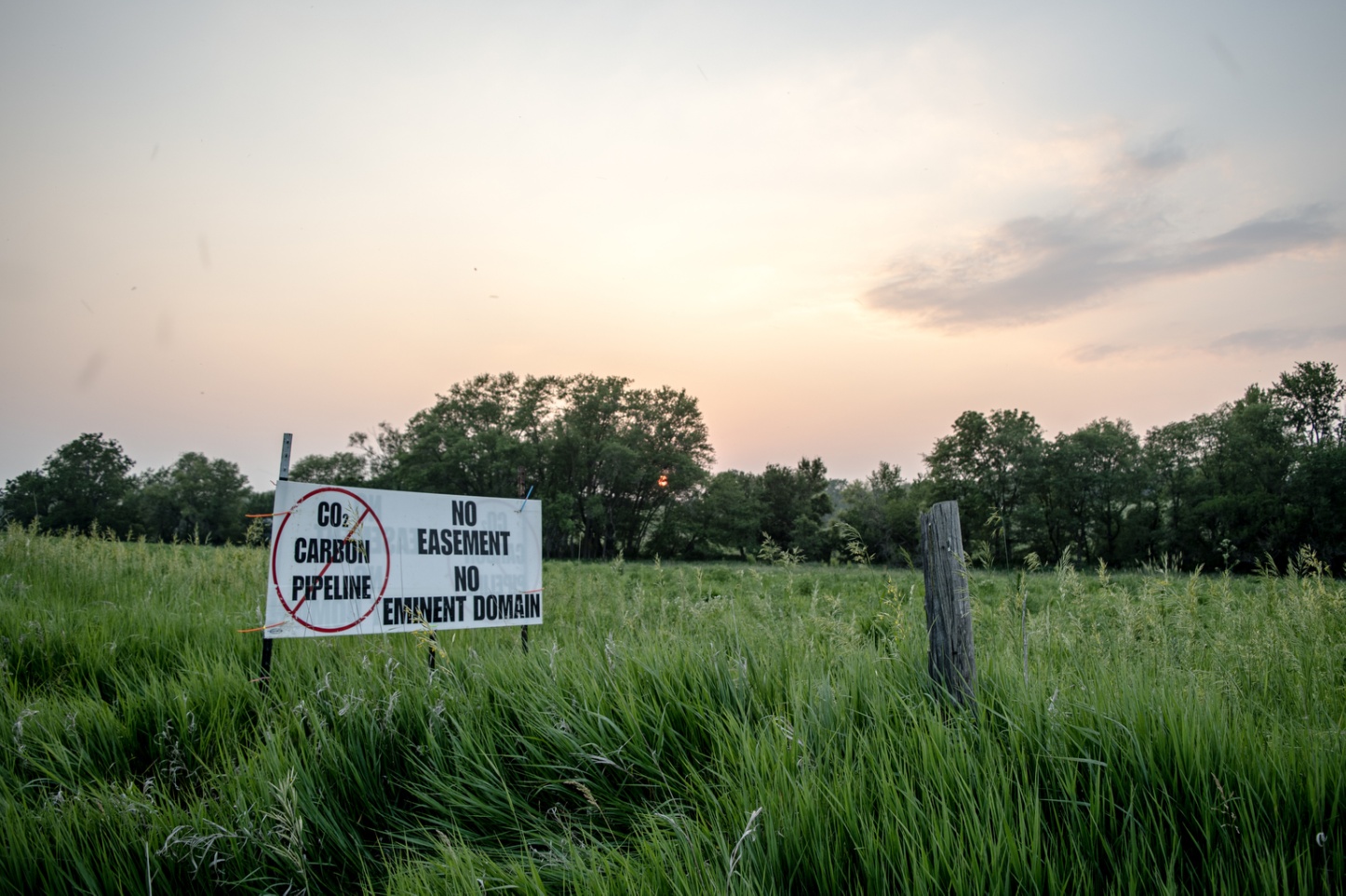 A sign against a proposed carbon dioxide pipeline outside a home in New Liberty, Iowa, on&nbsp;June 4, 2023. The Biden administration is all-in on carbon capture and storage. But the pipelines needed to move the greenhouse gas around face stiff local opposition.