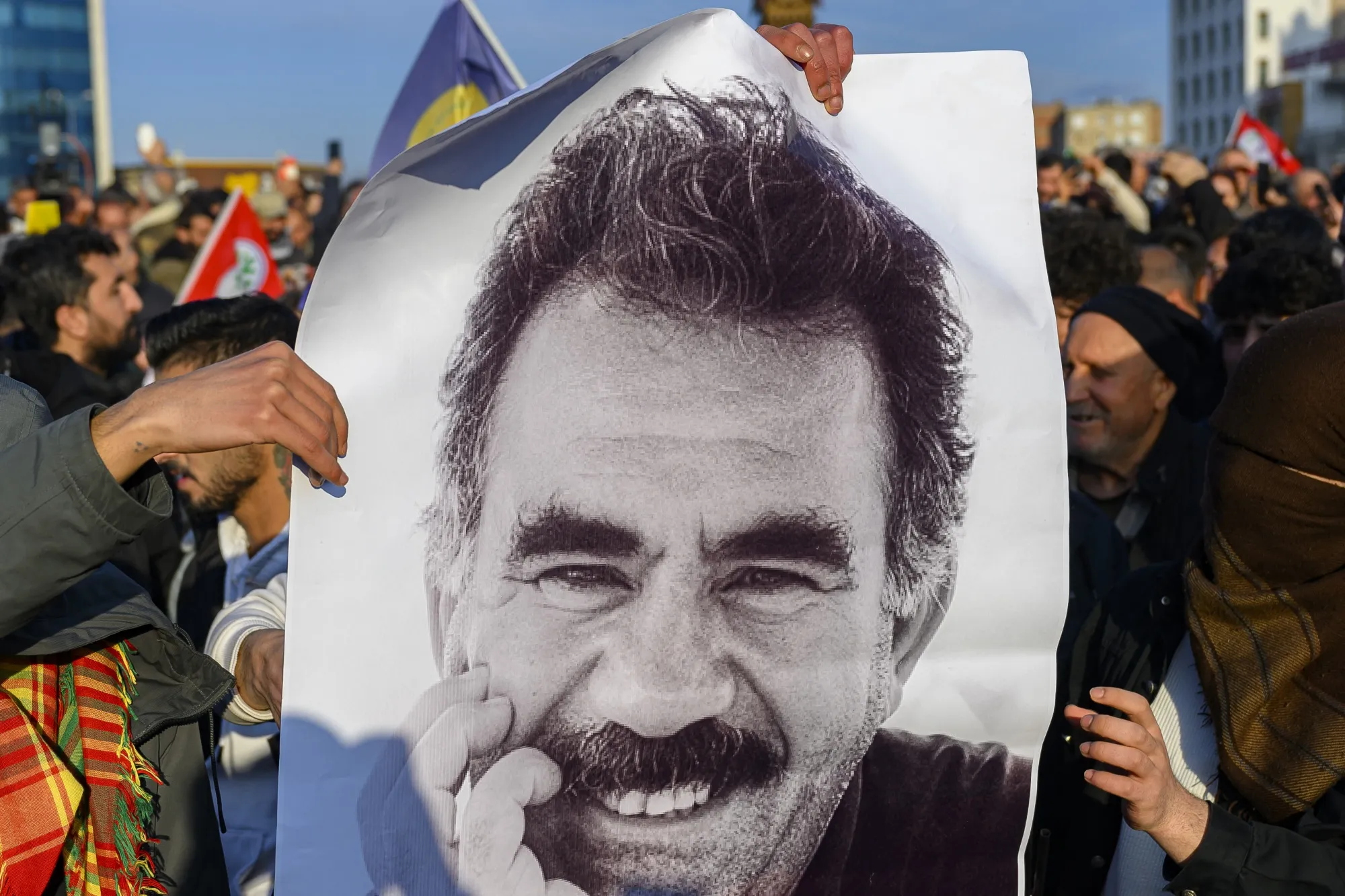 Supporters display a poster depicting Abdullah Ocalan.