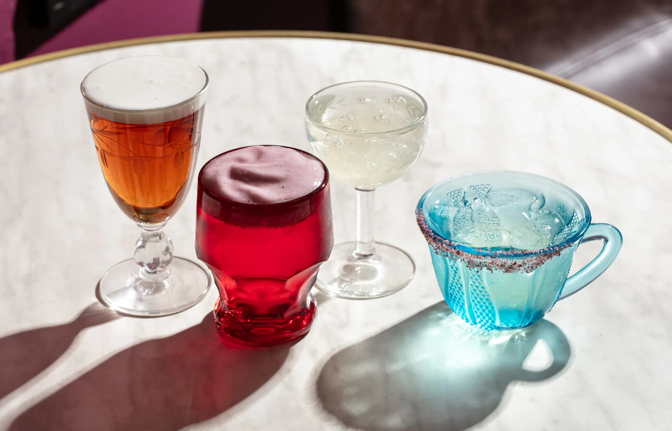 From left: Jelas’&nbsp;Vietnamese Coffee; Whiskey Cloud, an ode to the New York Sour; Die Die Must Try, with shochu and Champagne; and margarita.