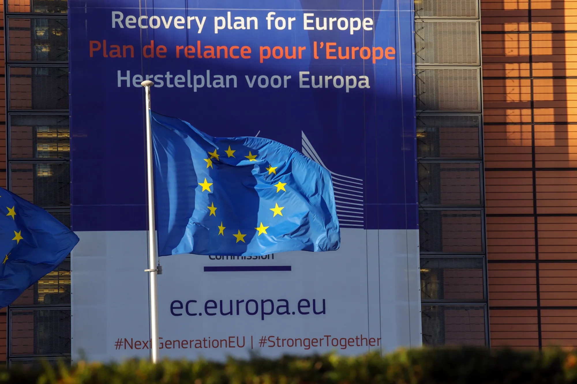 European Union flags fly outside the Berlaymont building in Brussels.