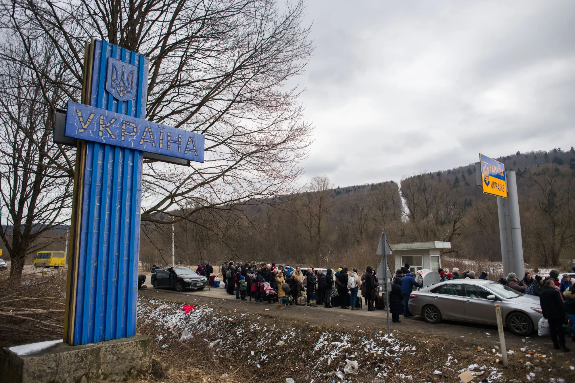 Displaced Ukrainians arrive at the Smilnytsia-Krościenko border crossing in Kyriv, Ukraine.