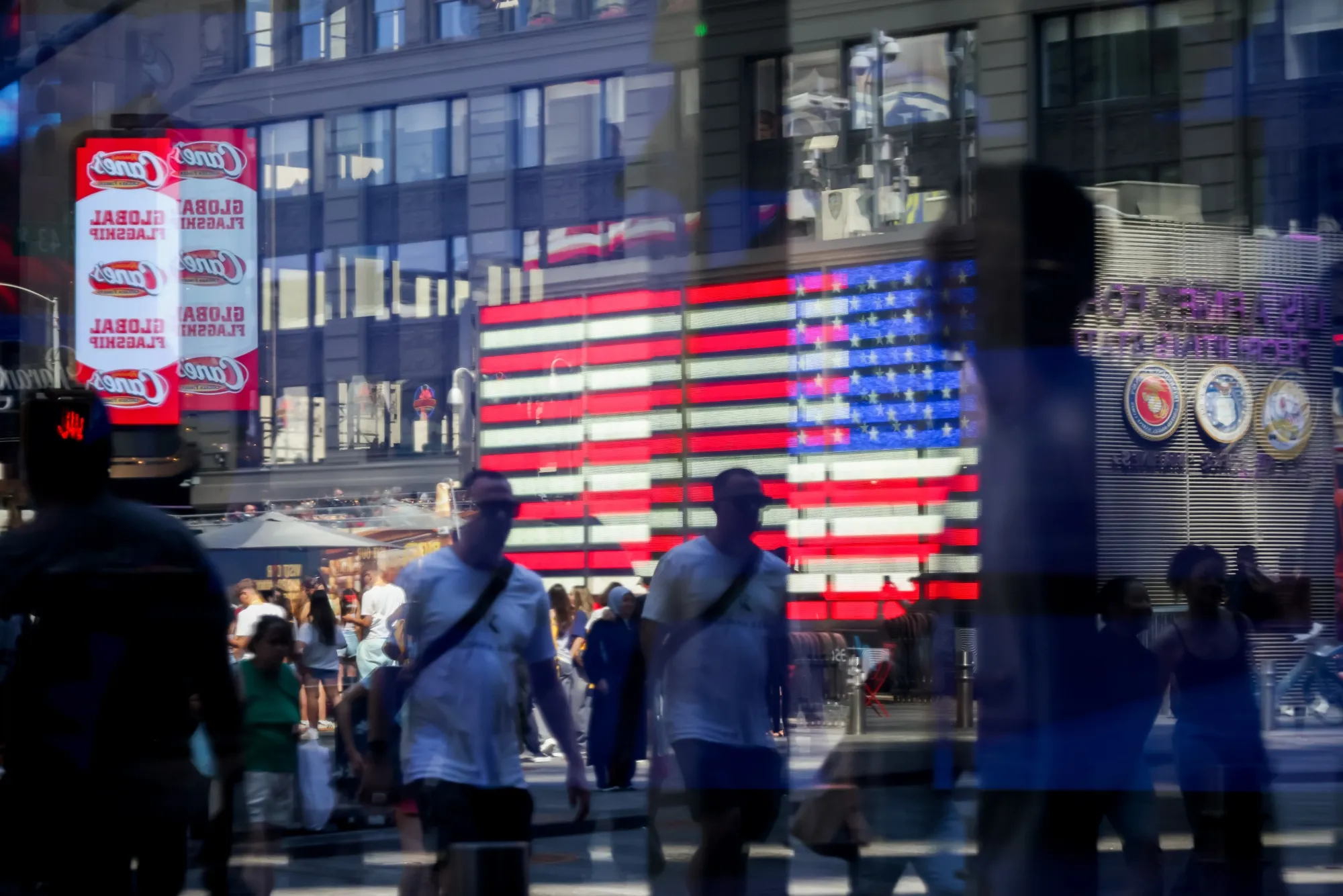 Pedestrians near the Nasdaq MarketSite in New York.