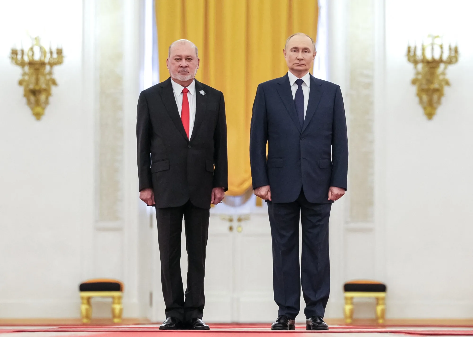 This photograph distributed by Russia’s state agency shows Vladimir Putin and King Sultan Ibrahim in Moscow on Aug. 6.