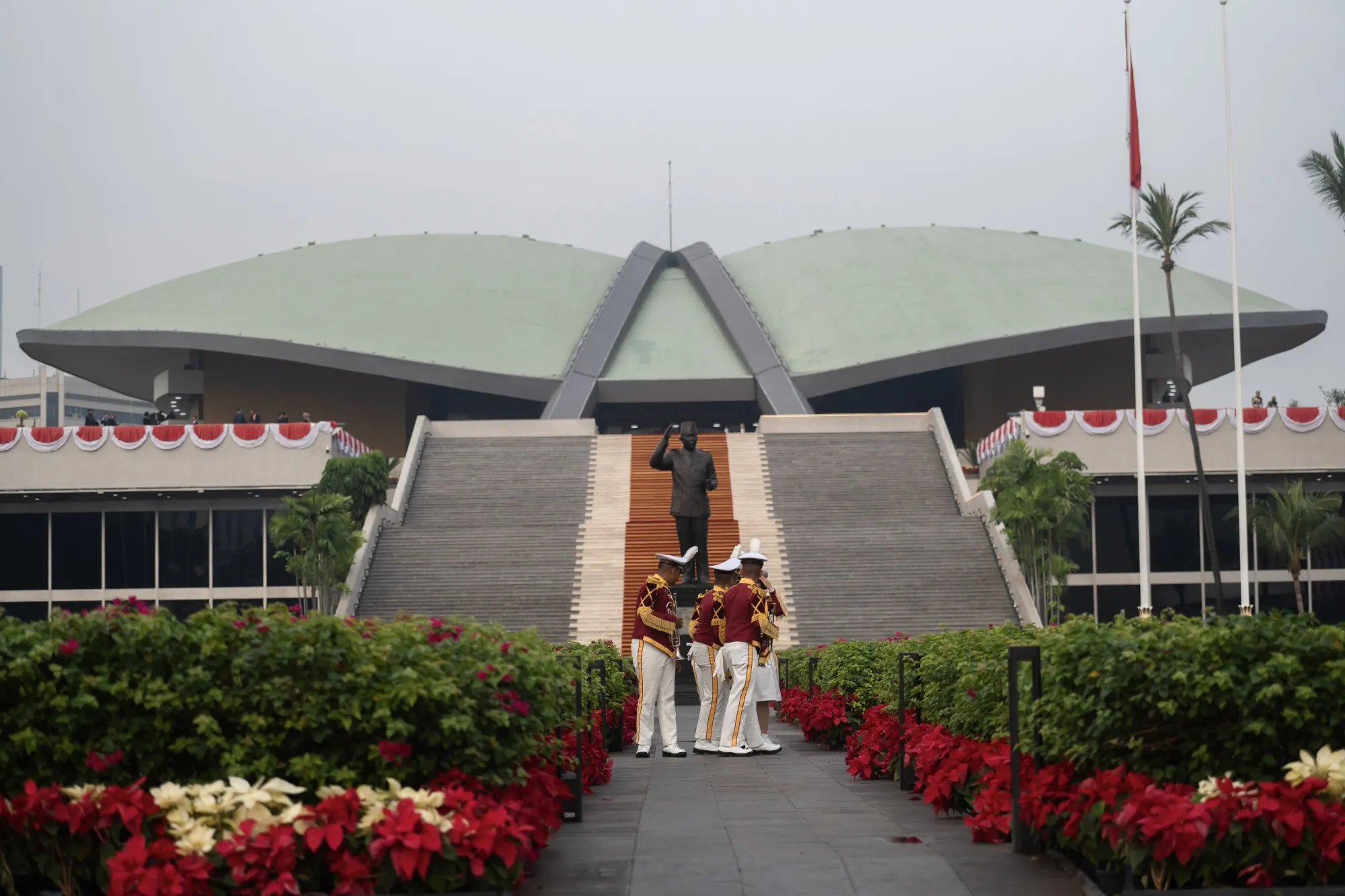 Marching band members in front of the parliament building in Jakarta.