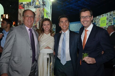 Larry Fink, Filipa Fink, Joshua Fink and Mark McCombe. Photographer: Amanda Gordon/Bloomberg