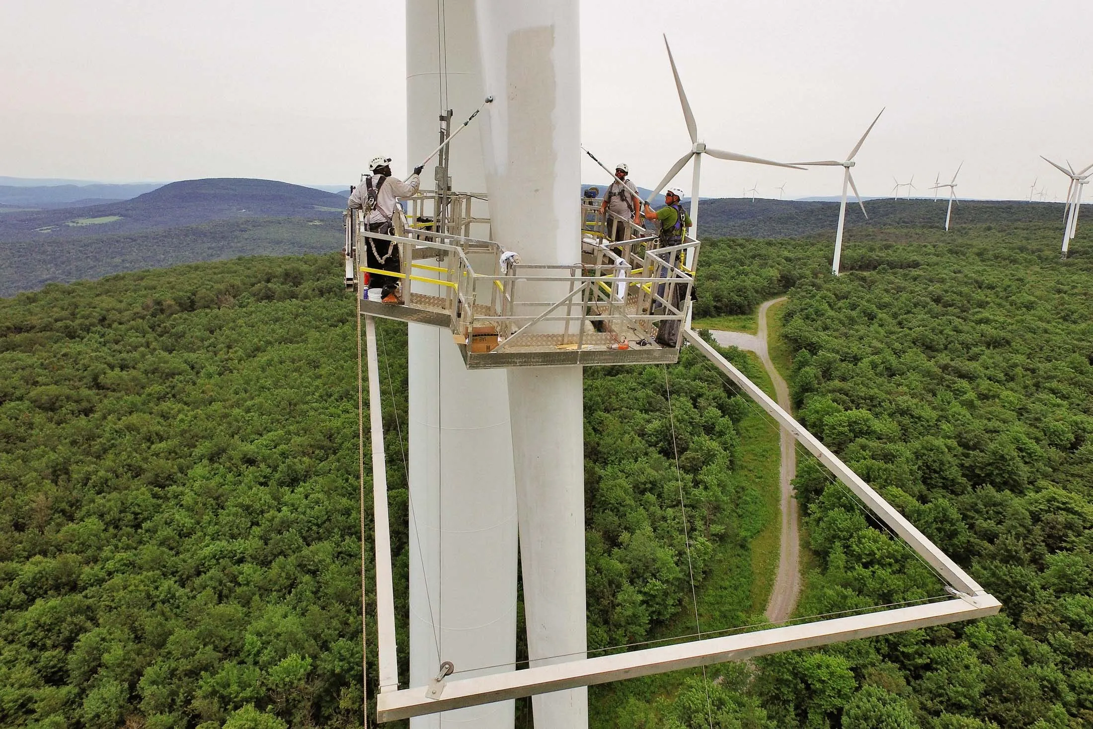 Workers applying an anti-ice coating to a turbine in Pennsylvania&nbsp;in 2015, a job they acquired through Workrise