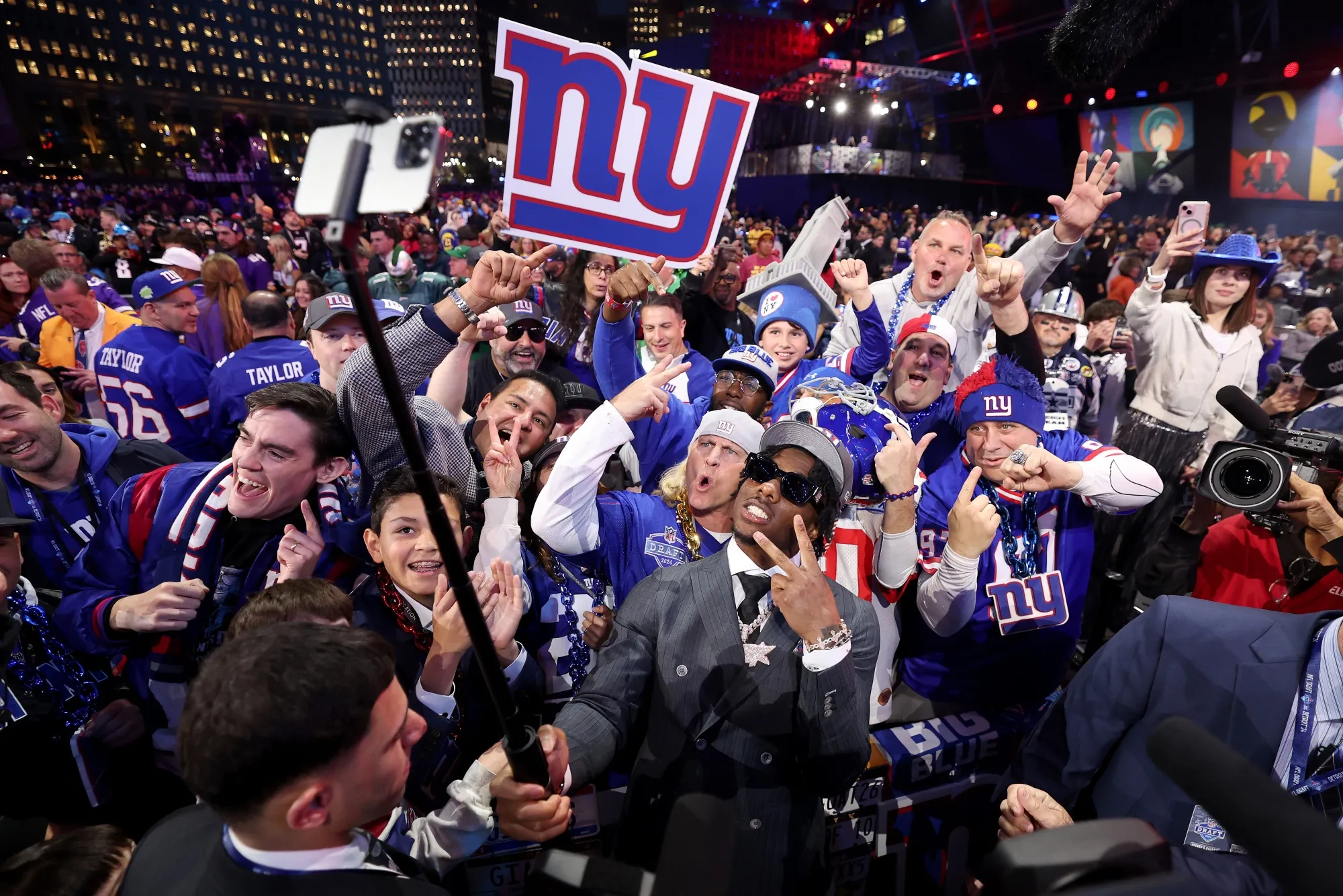 Malik Nabers celebrates with fans after being selected by the New York Giants during the first round of the 2024 NFL Draft in Detroit, Michigan.&nbsp;
