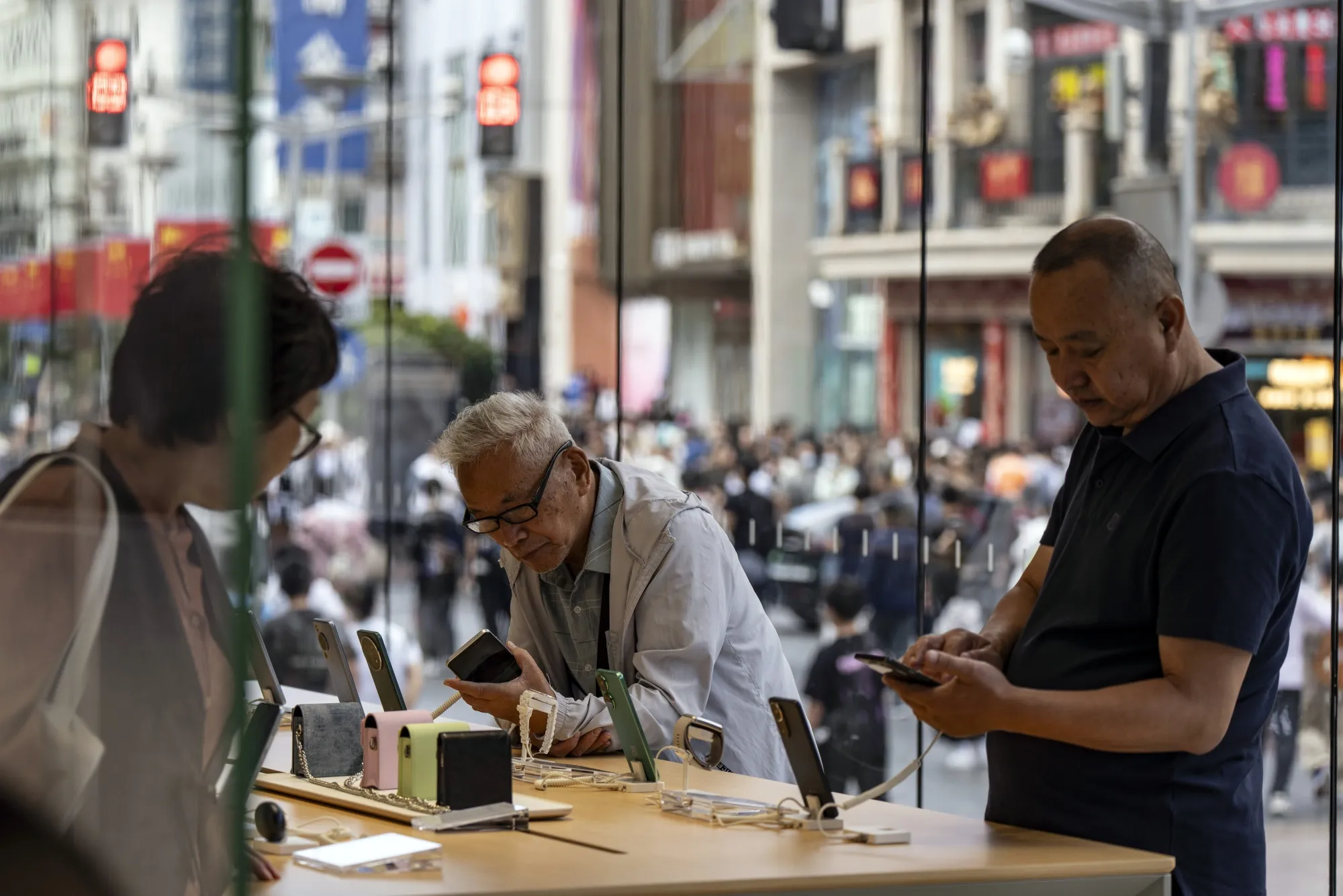 Shoppers on Nanjing East Road in Shanghai.