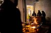 Saudi women work at the reception desk of a restaurant in Buraidah, Saudi Arabia.