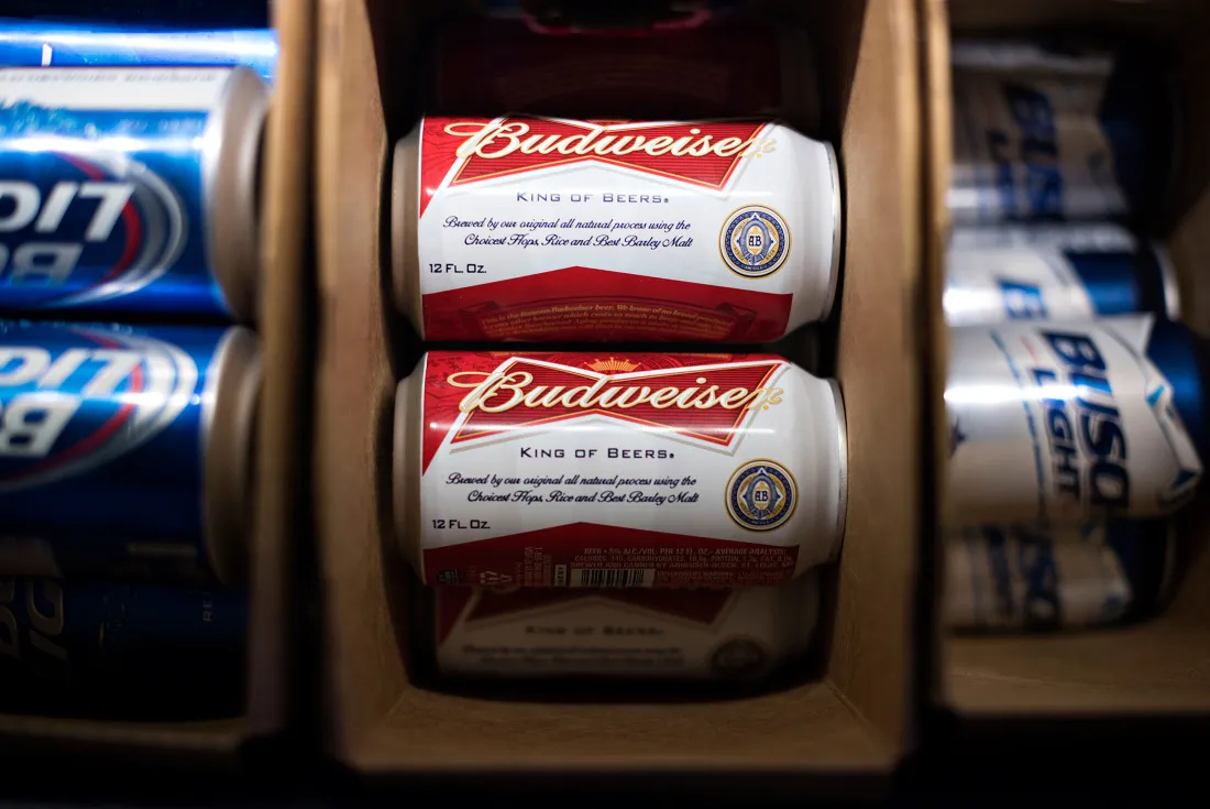 Anheuser-Busch Budweiser, Bud Light, and Busch Light brand beers sit in a refrigerator at a bar in Princeton, Illinois, U.S., on Tuesday, Oct. 28, 2014.
