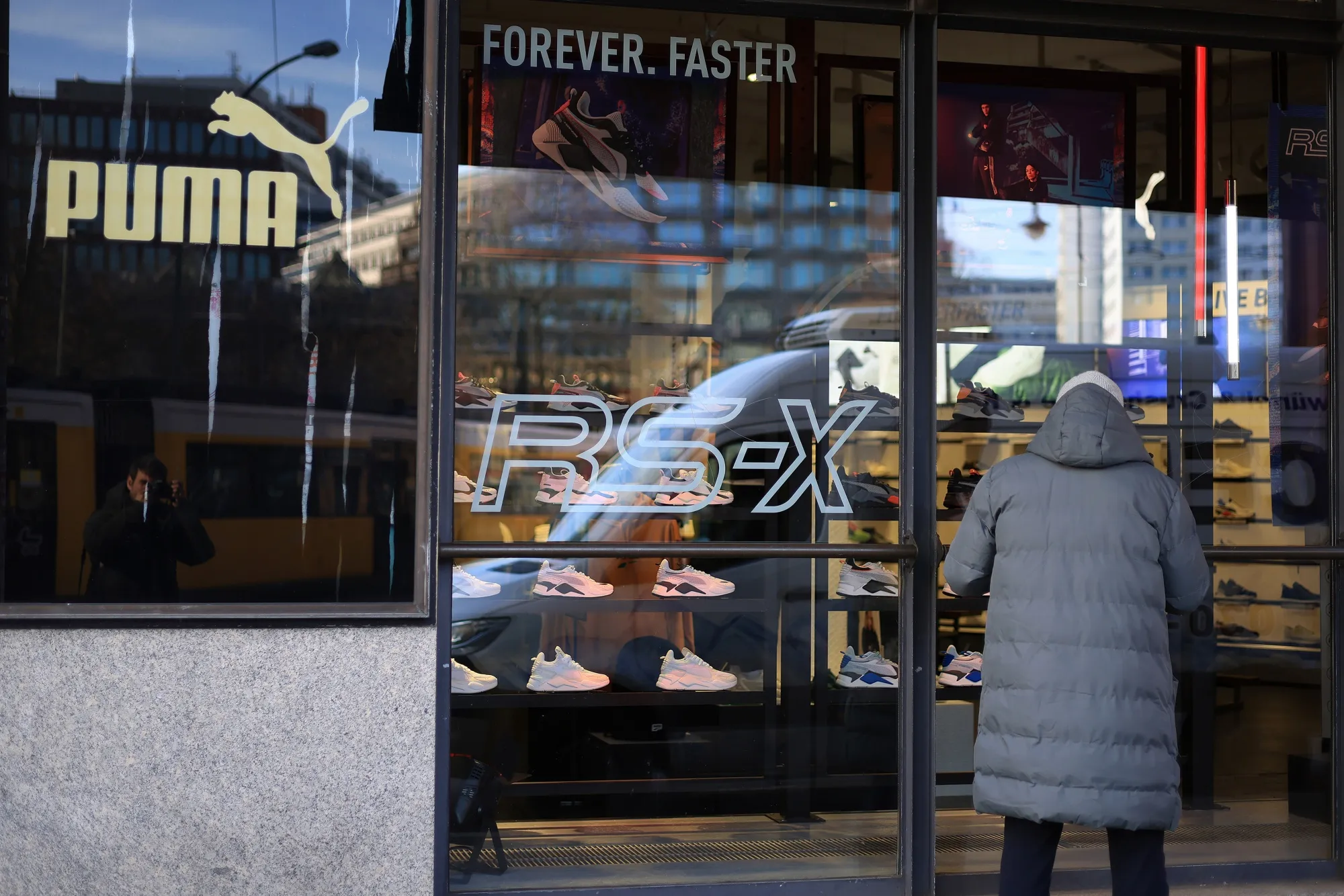 A customer enters a Puma store in Berlin.