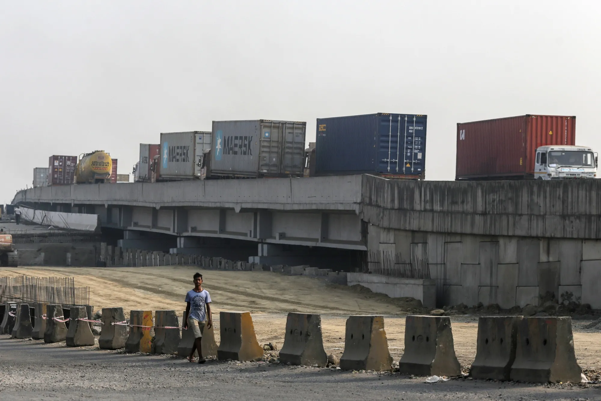 Trucks transporting shipping containers leave the Jawaharlal Nehru Port in Navi Mumbai.