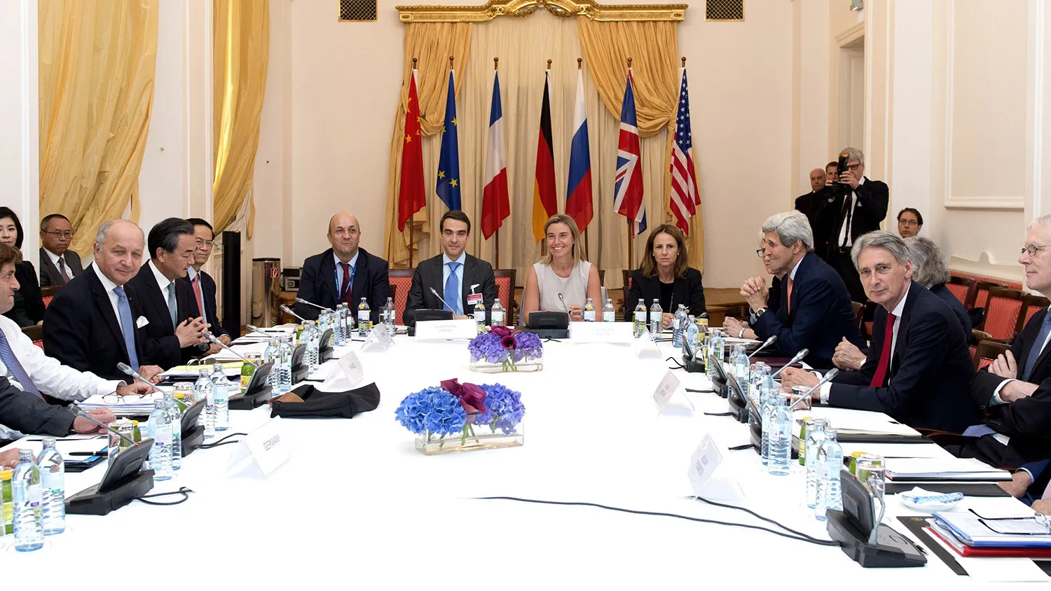 German Foreign Minister Frank-Walter Steinmeier (L), French Foreign Minister Laurent Fabius (3rd L), China's Foreign Minister Wang Yi (4th L), High Representative of the European Union for Foreign Affairs and Security Policy, Federica Mogherini (C), US Secretary of State John Kerry (4th R), British Foreign Minister Philip Hammond (3rd R) and Russian Foreign Minister Sergey Lavrov (R) meet at the table at the Palais Coburg Hotel, where the Iran nuclear talks meetings are being held, in Vienna, Austria on July 7, 2015. Talks seeking a landmark nuclear deal between Iran and major powers may yet fail, a German diplomatic source said during a break in negotiations in Vienna on the eve of a deadline. AFP PHOTO / JOE KLAMAR (Photo credit should read JOE KLAMAR/AFP/Getty Images)
