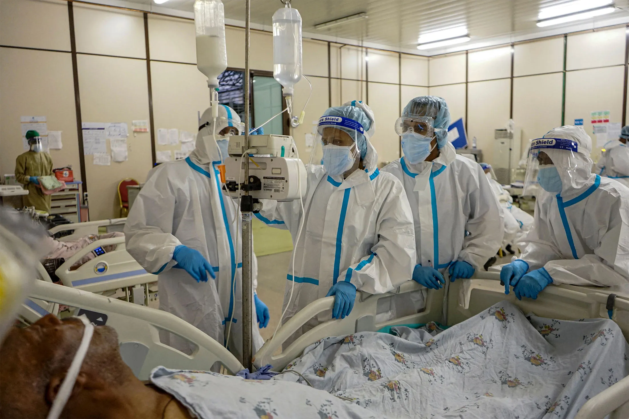 Healthcare workers check the monitor of a&nbsp;Covid-19 patient in the ICU of the makeshift hospital at an event center in Addis Ababa, Ethiopia, on March 18.&nbsp;
