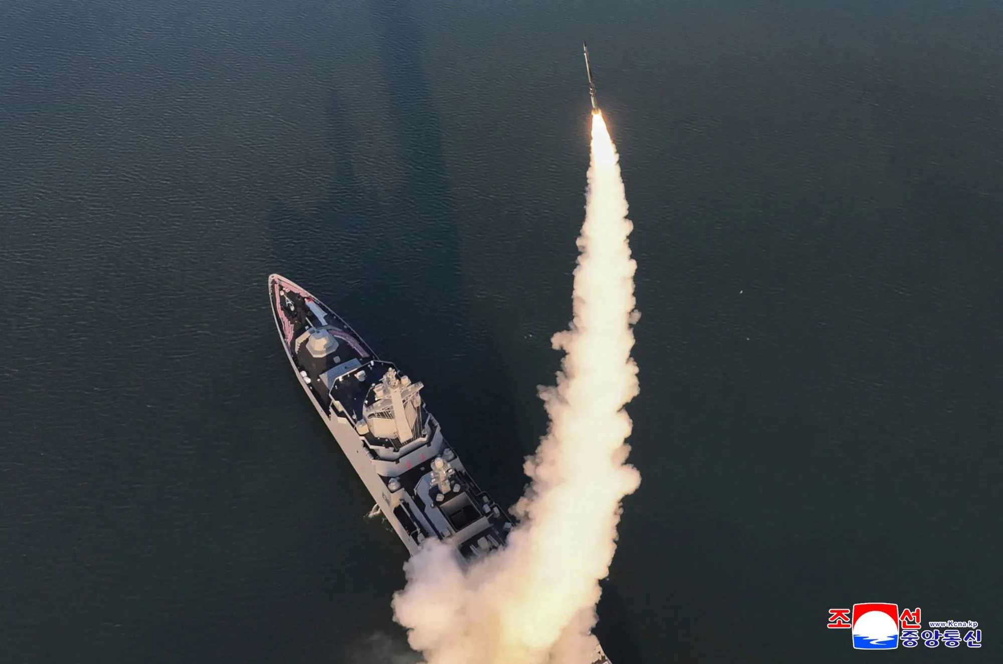 This photo by the North Korean government shows the test-firings of missiles from a newly launched destroyer “Choe Hyon.”