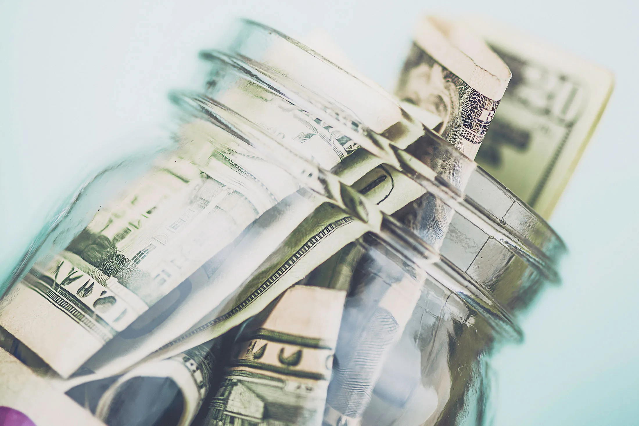 Donation jar overflowing with American money. Fundraising, Savings, Wealth Concepts.