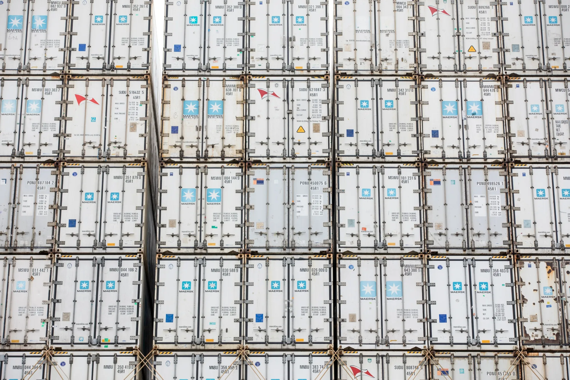 Shipping containers stand on the dockside at the Port of Felixstowe Ltd., a subsidiary of CK Hutchison Holdings Ltd., in Felixstowe, U.K., on Friday, March 22, 2019.
