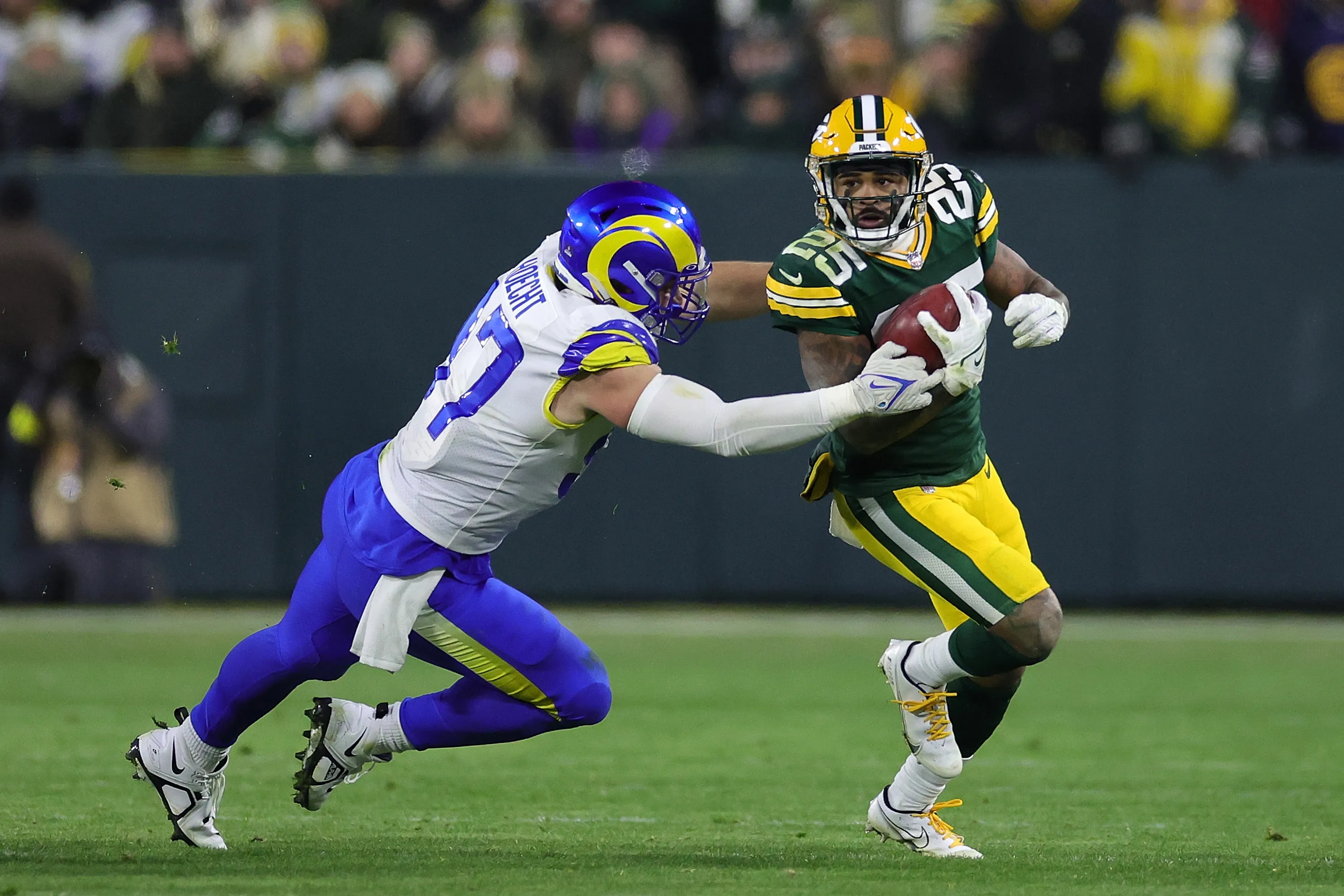 Keisean Nixon #25 of the Green Bay Packers is pursued by Michael Hoecht #97 of the Los Angeles Rams during a game on December 19&nbsp;in Green Bay, Wisconsin.