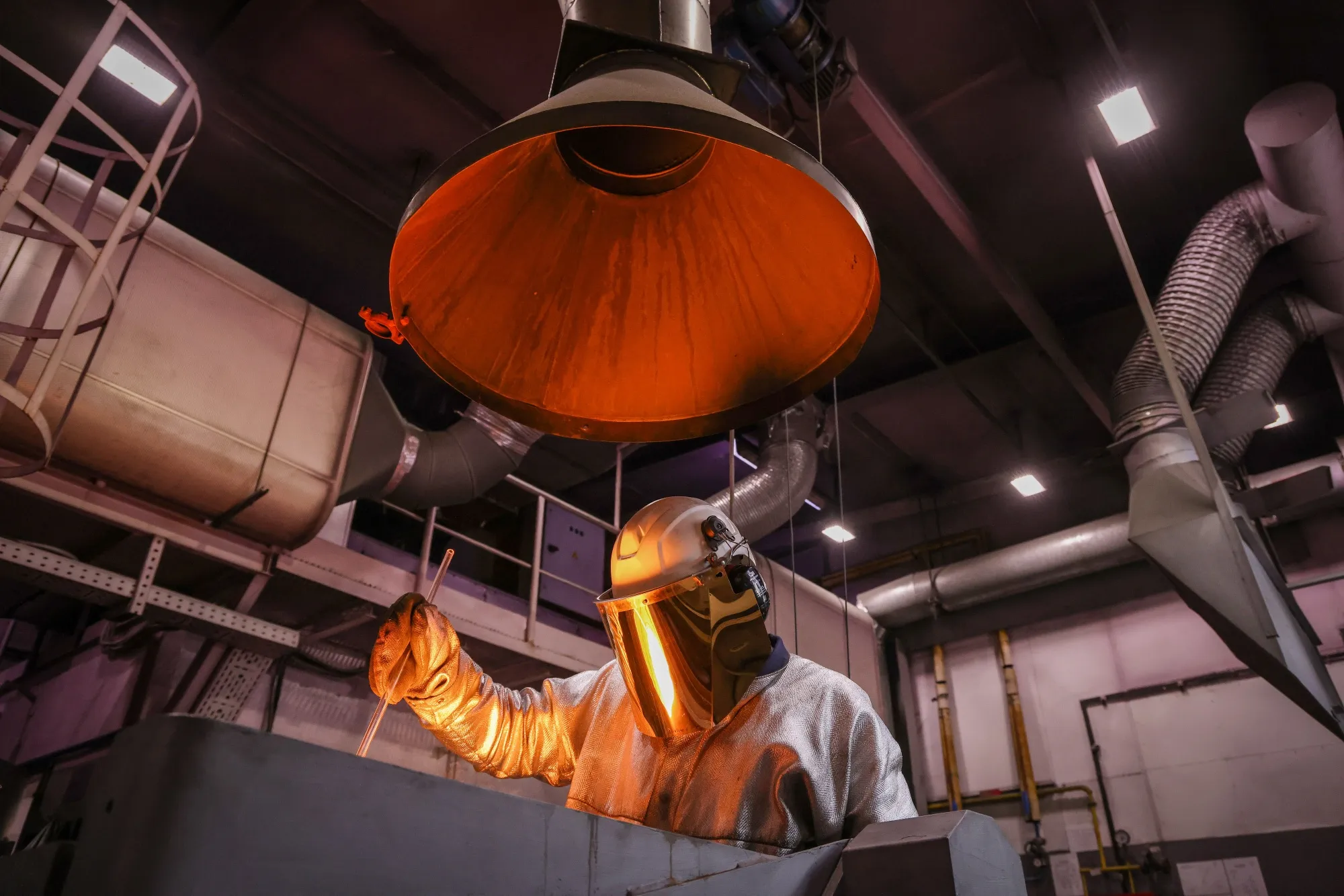 A worker melts gold into a crucible in the foundry at a metals plant in Krasnoyarsk, Russia.
