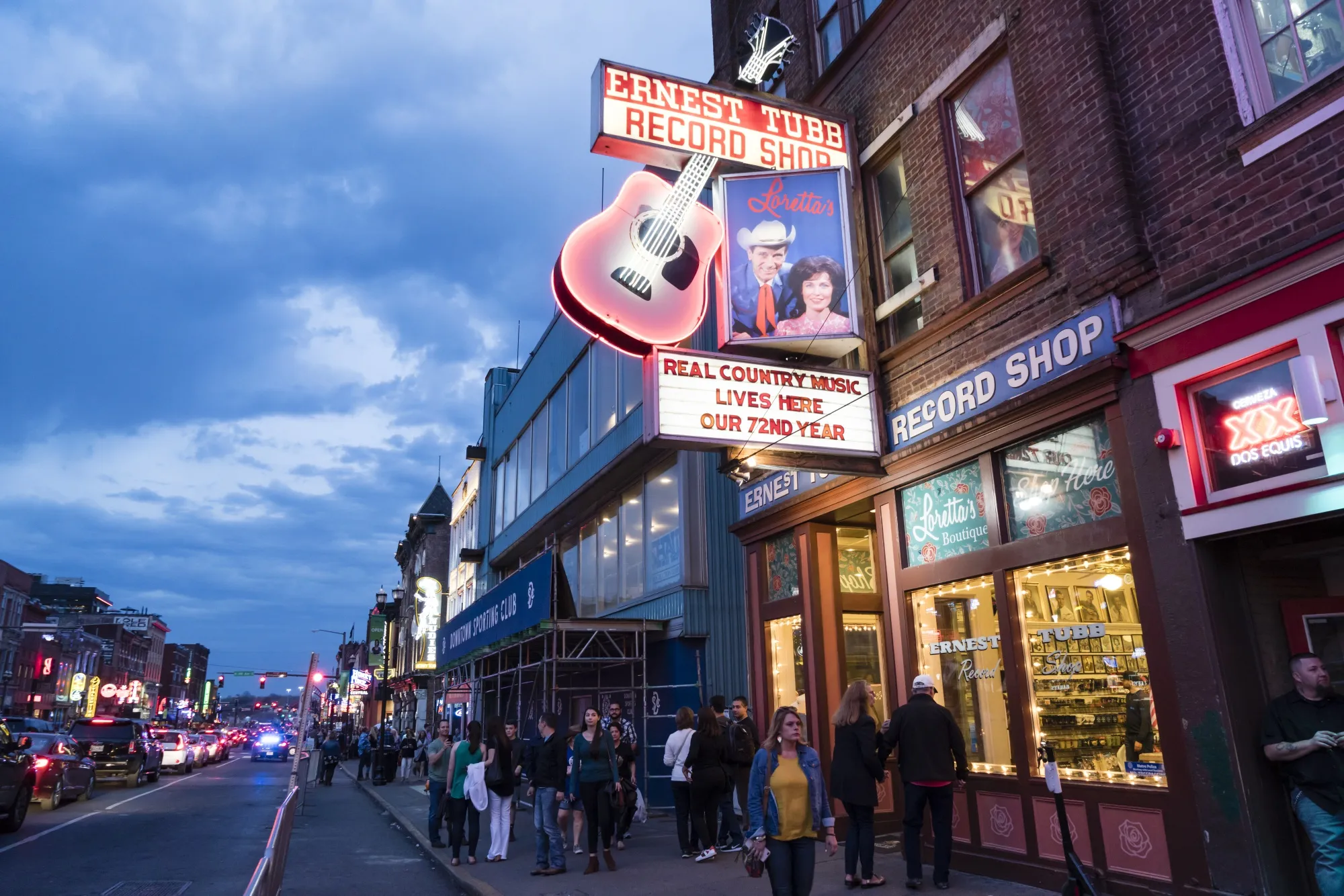 Pedestrians pass in front of the Ernest Tubb Record Shop in downtown Nashville.