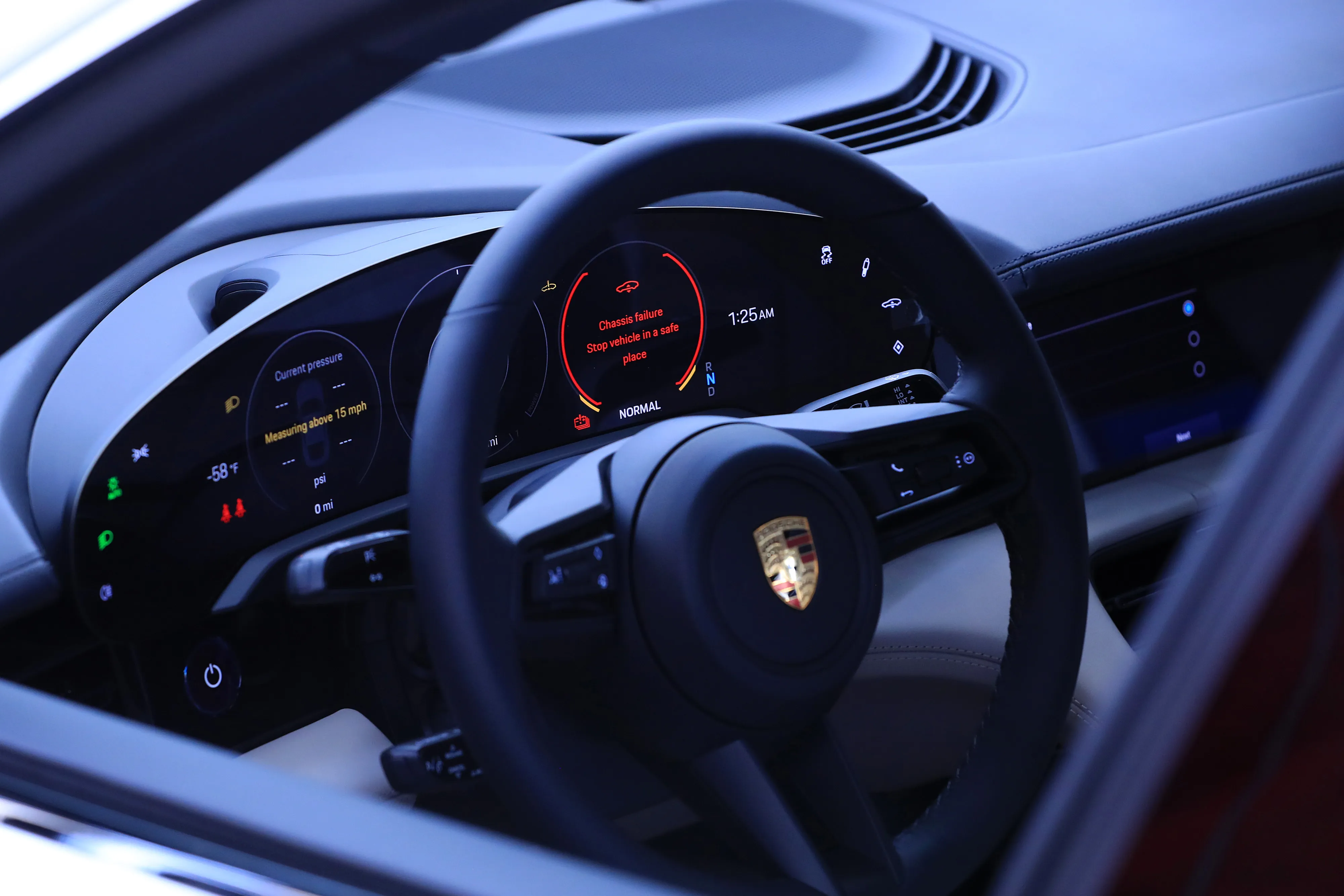 The dashboard display of an all-electric Porsche AG Taycan luxury automobile.