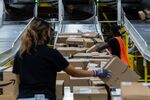 Workers retrieve boxes at an Amazon fulfillment center&nbsp;in Raleigh, North Carolina,&nbsp;on&nbsp;June 21.&nbsp;